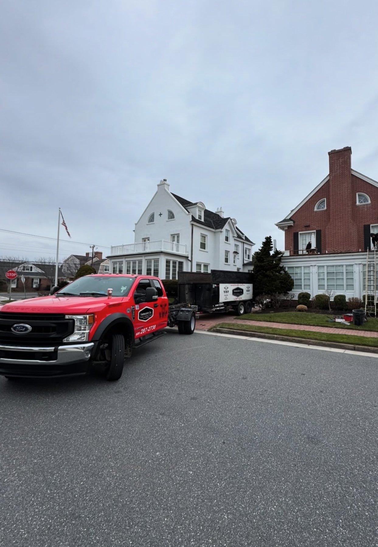 Fantazzia's Co. truck and trailer on a shore street